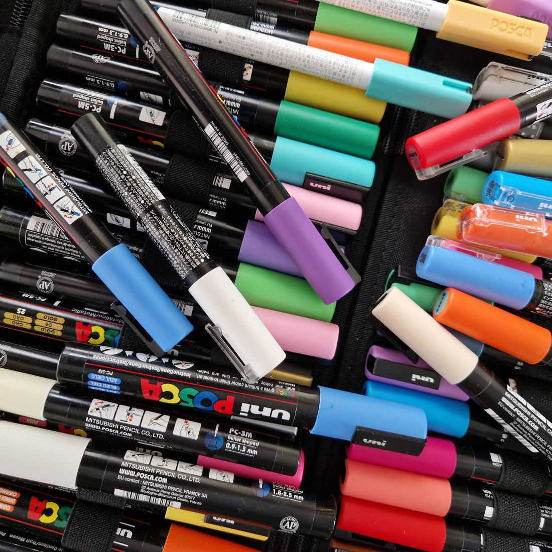 A bunch of colorful posca markers