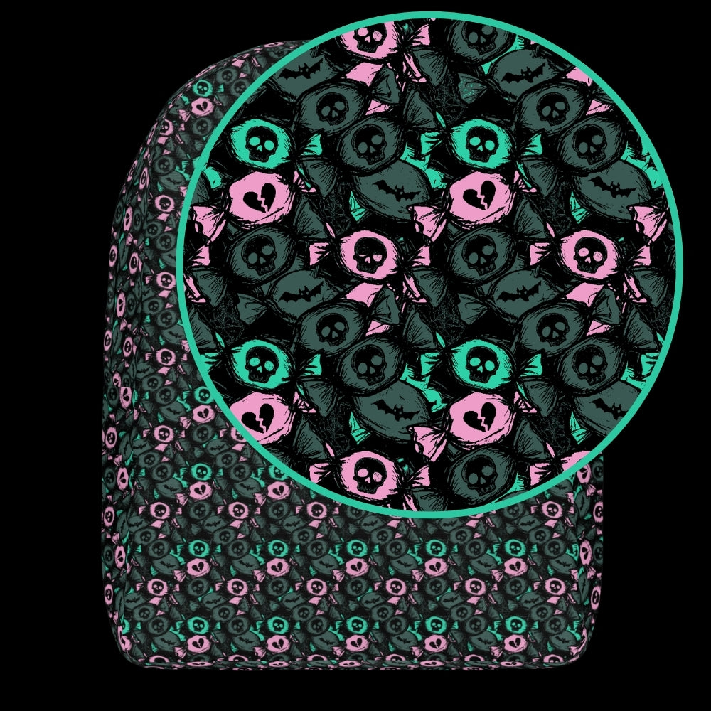 a backpack with an alt emo skull candy pattern in grey mint and pink