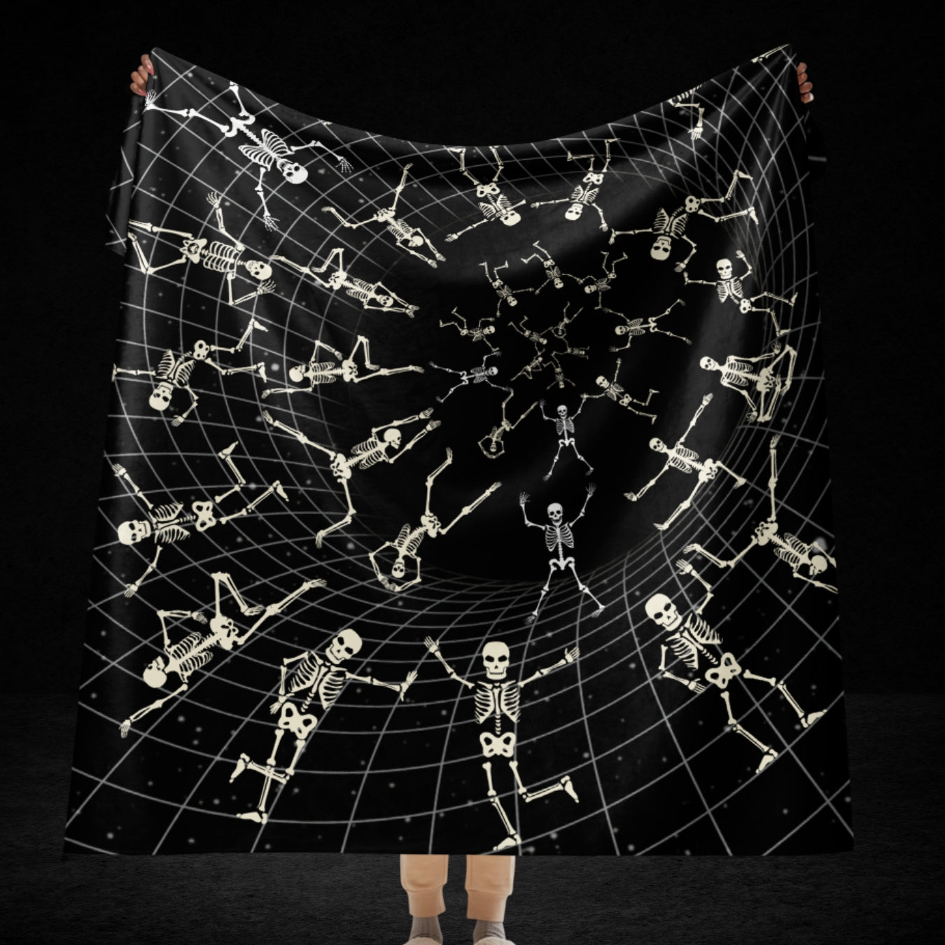 A large sherpa blanket with a vortex grid with skeletons clinging to it, falling and jumping into the void