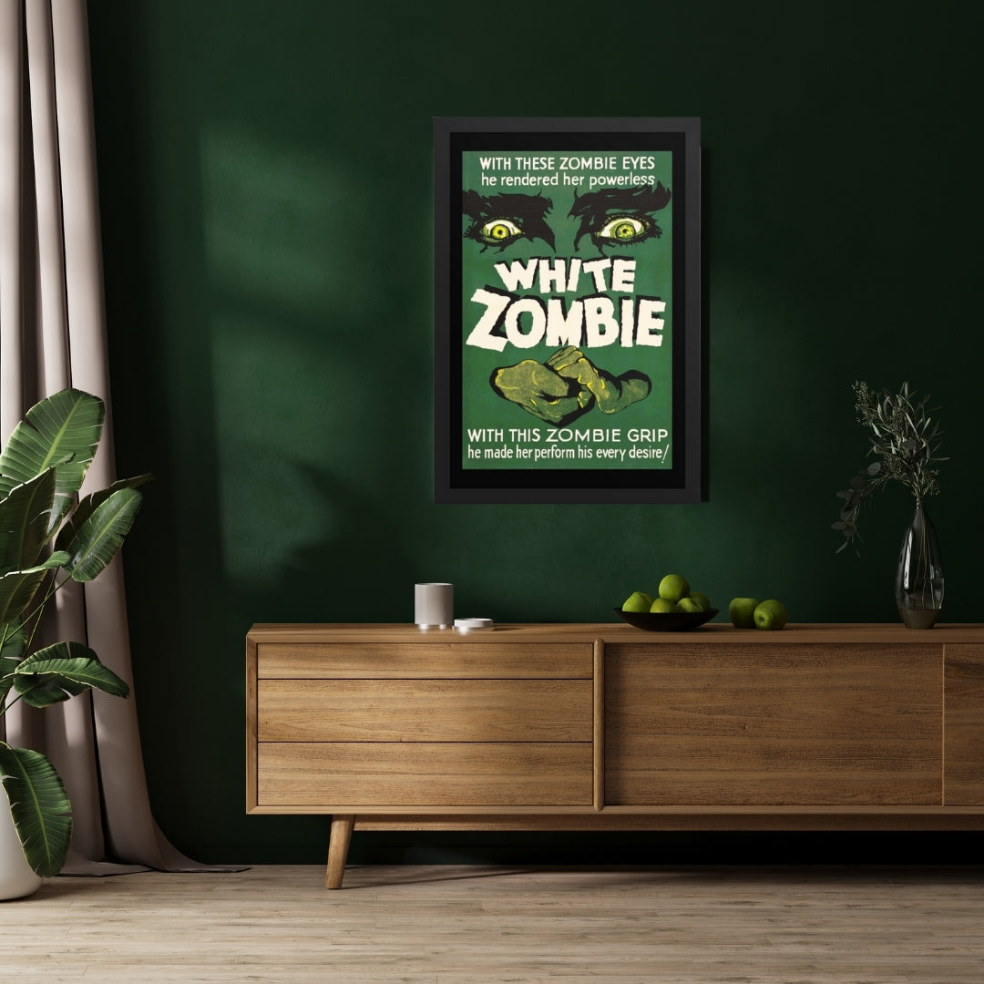 a framed poster with a vintage horror movie design, white zombie on a wall