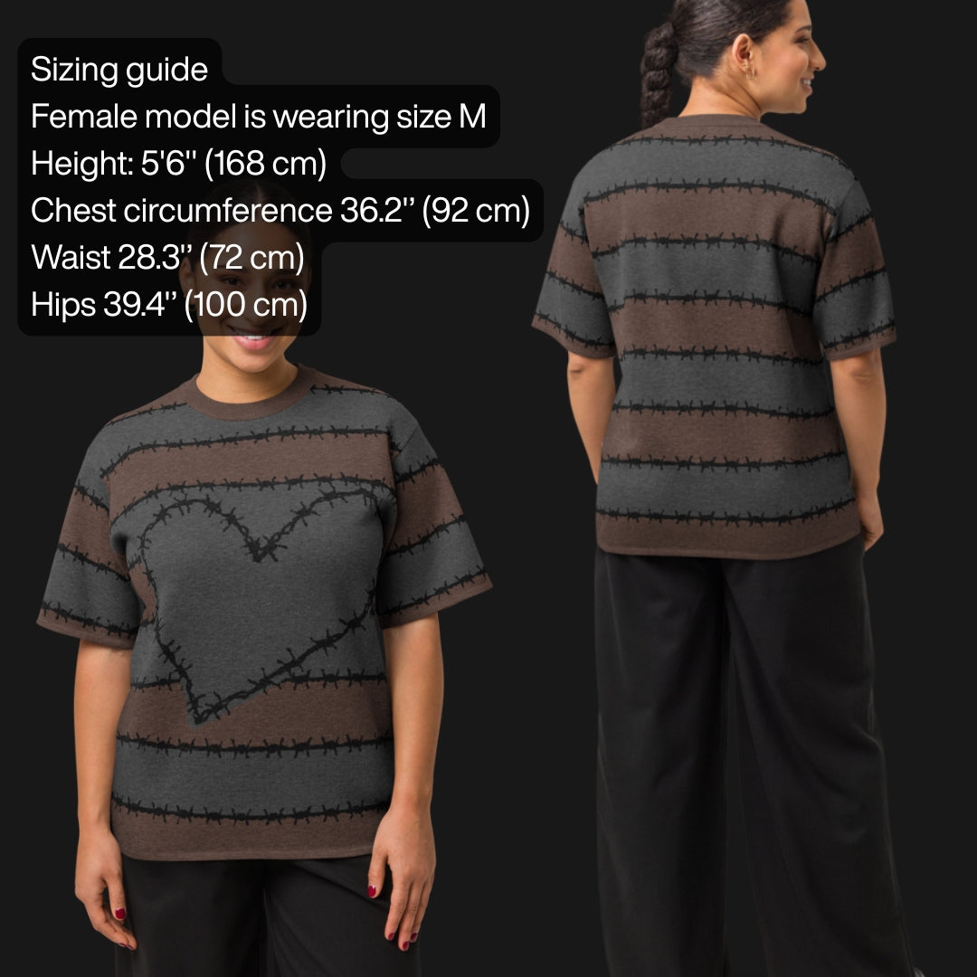 A jacquard knitted tee in dark moody shades, featuring stripes and a large heart lined with barbed wire