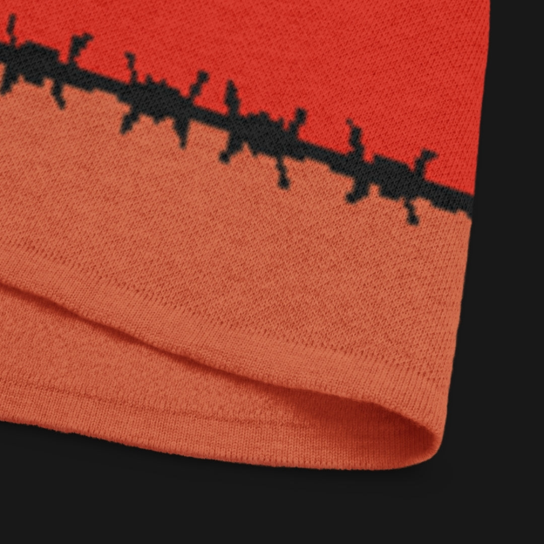 A knitted tee with barbed stripes and a barbed heart