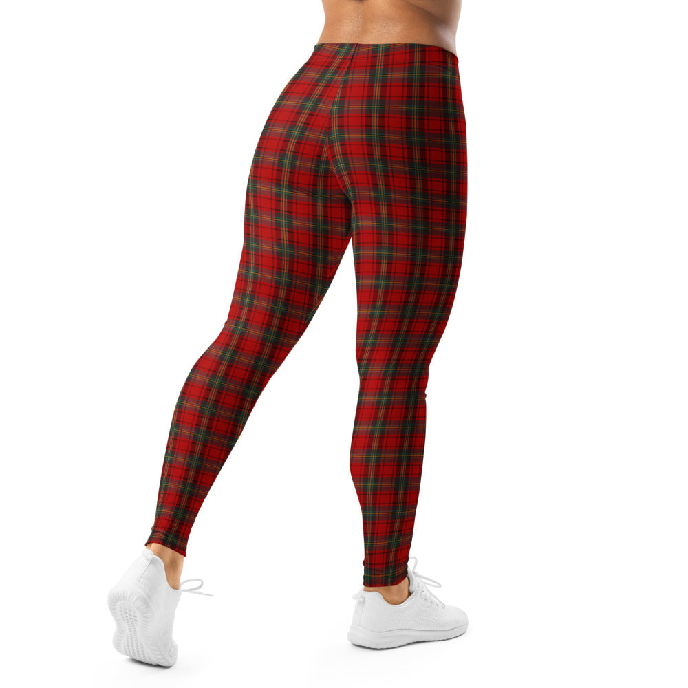 Red plaid leggings worn by a person on a white background