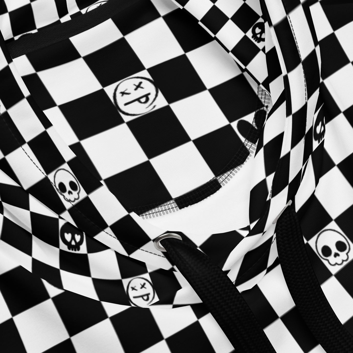 close up of a black and white checkered hoodie with emo symbols on some squares