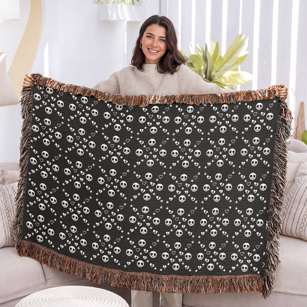 woven blanket with a geometric pattern of stitch mouth skulls