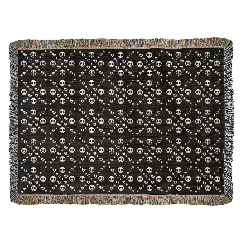 woven blanket with a geometric pattern of stitch mouth skulls