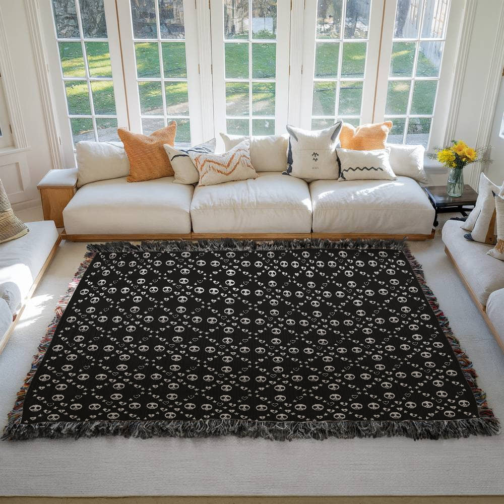 woven blanket with a geometric pattern of stitch mouth skulls