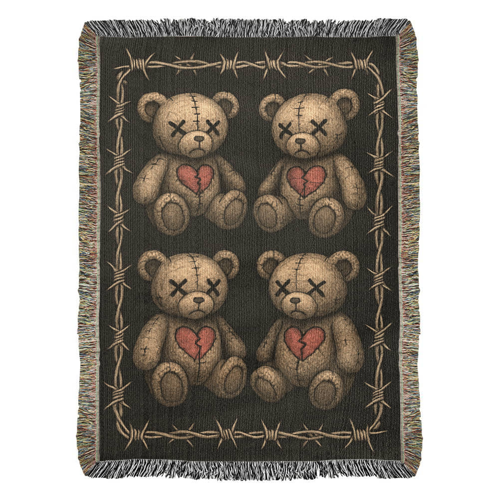 a woven blanket with x-eyed teddy bears on a dark background and surrounded by a frame of barbed wire