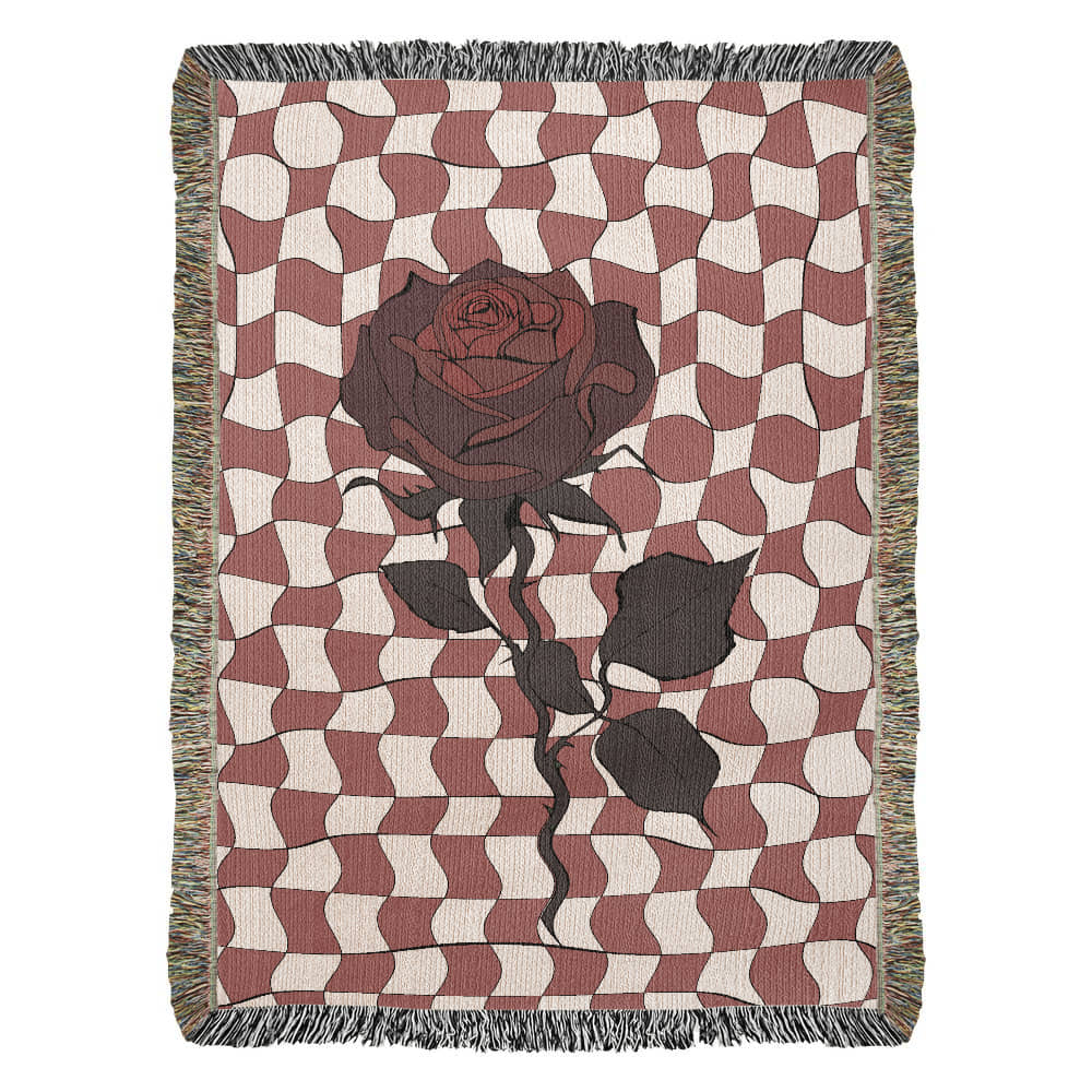 a woven blanket featuring distorted checkerboard patterns and a deep red soulful rose