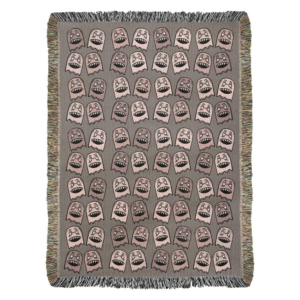 a woven blanket with a purplish grey and pink goblin pattern