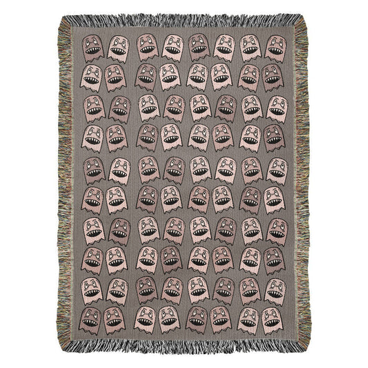 a woven blanket with a purplish grey and pink goblin pattern