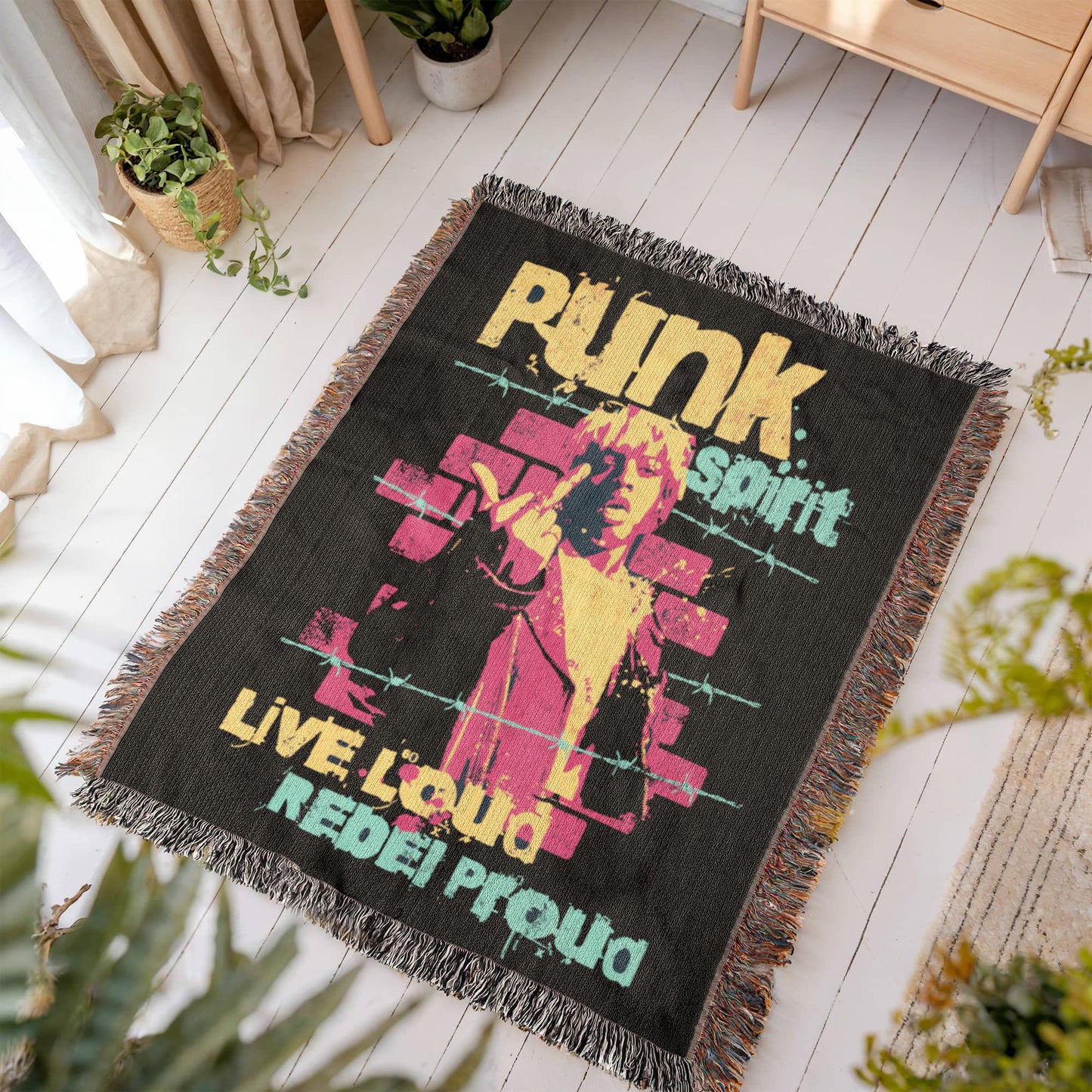 a woven blanket with text "punk spirit, live loud, rebel proud" and an rebellious image, in black, pink and yellow