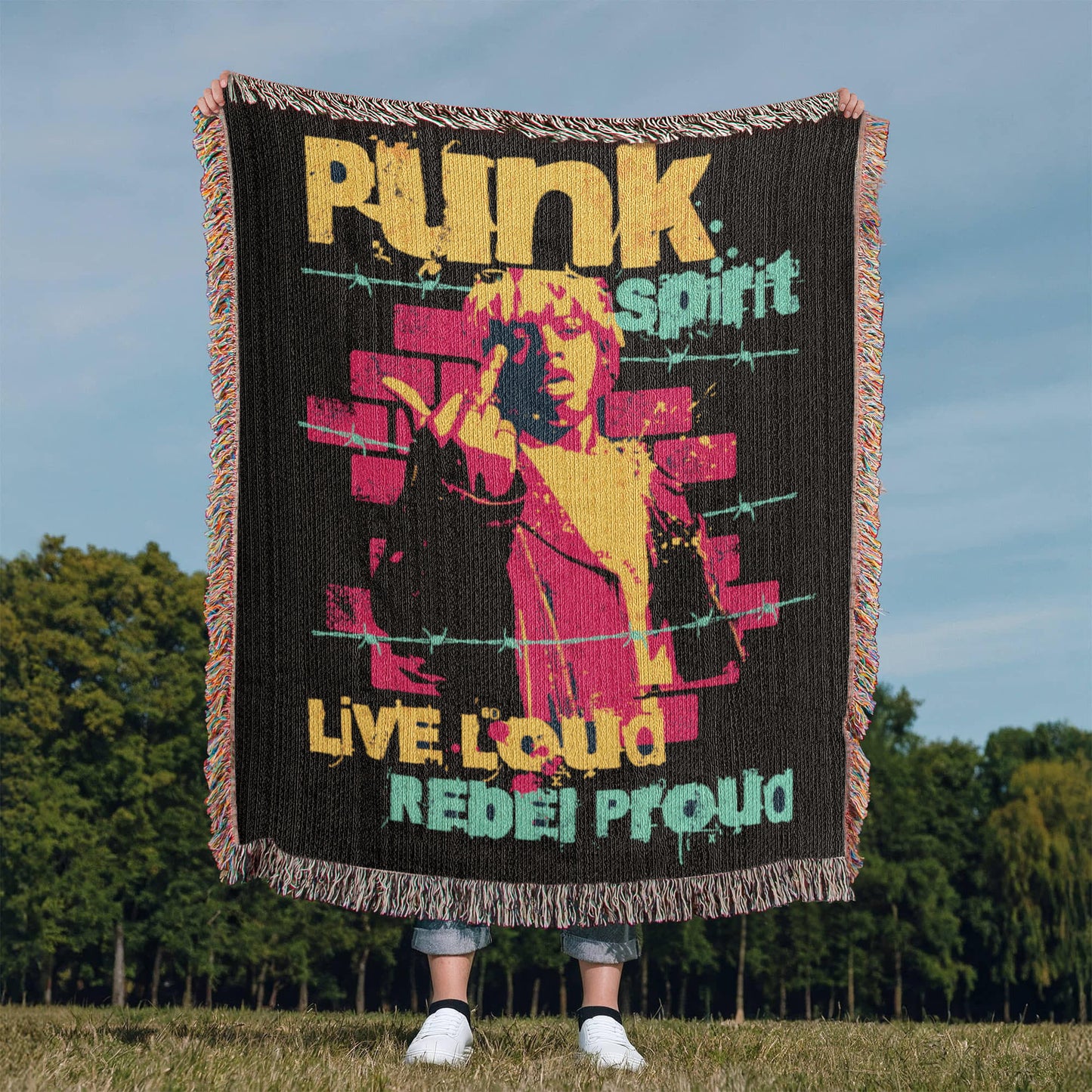 a woven blanket with text "punk spirit, live loud, rebel proud" and an rebellious image, in black, pink and yellow