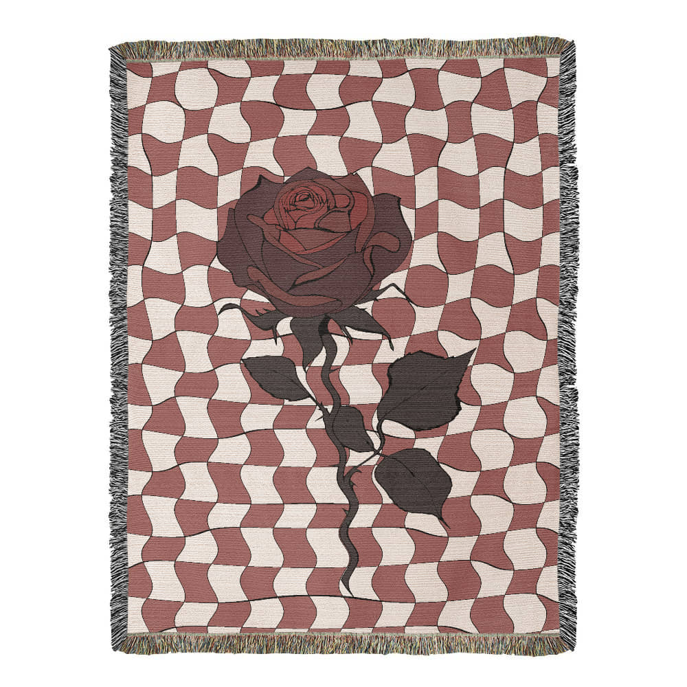 a woven blanket featuring distorted checkerboard patterns and a deep red soulful rose