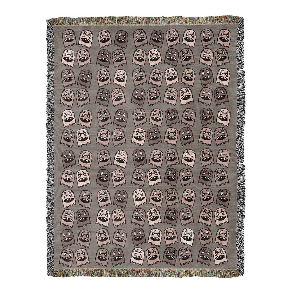 a woven blanket with a purplish grey and pink goblin pattern
