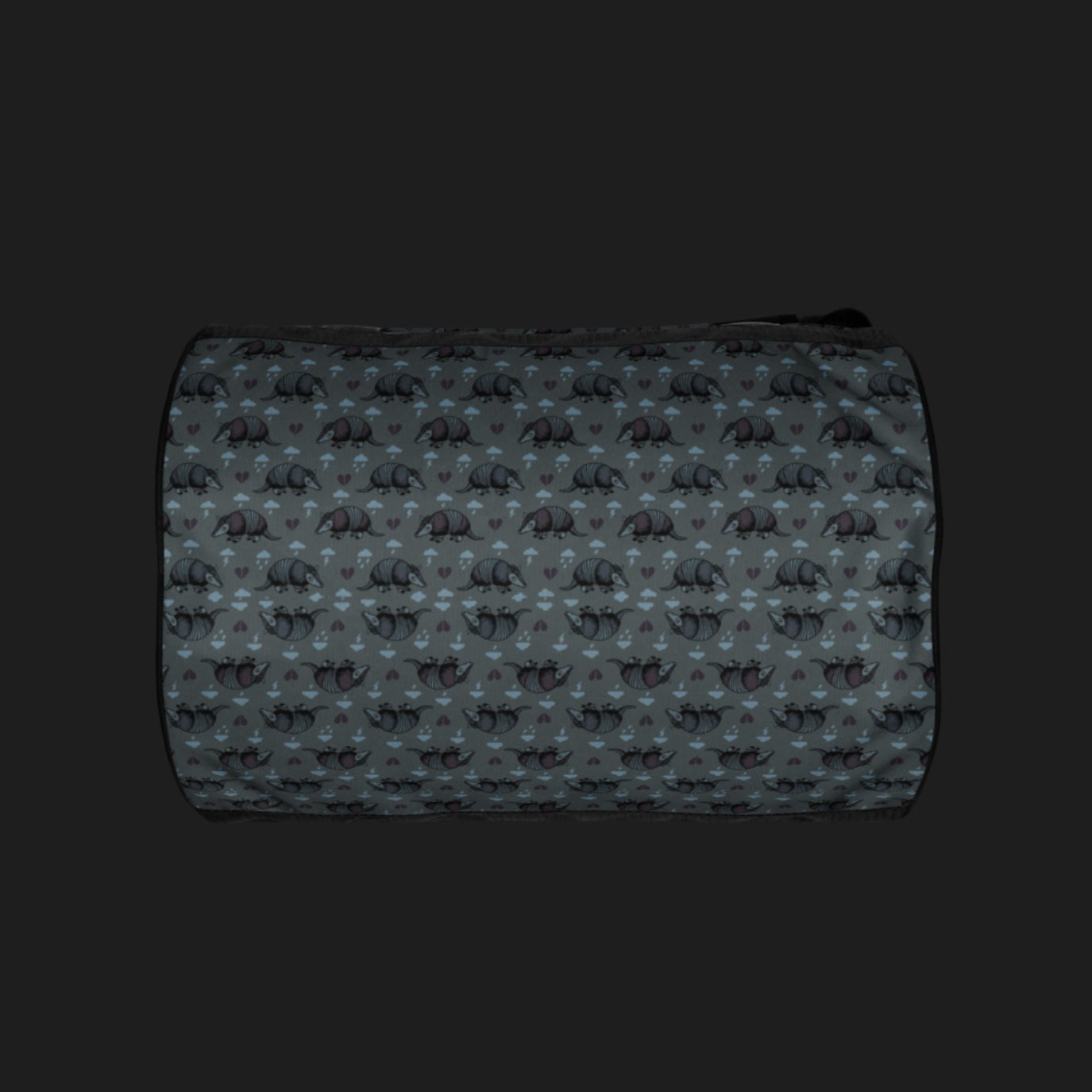 a duffel gym bag with an emo armadillo pattern with broken hearts and storm clouds