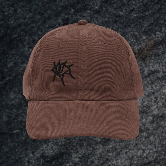A brown vintage corduroy cap with en emo eye embroidery