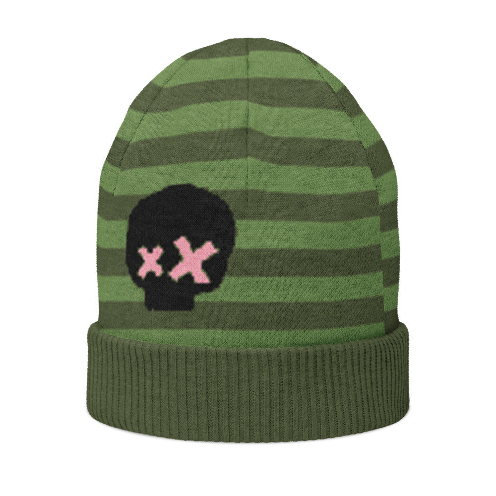 a green striped beanie with a black skull and pink x-eyes