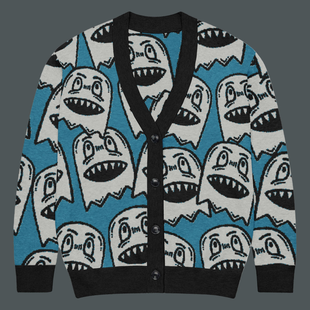 electric blue knitted cardigan with large grinning goblin heads in scene and grunge style