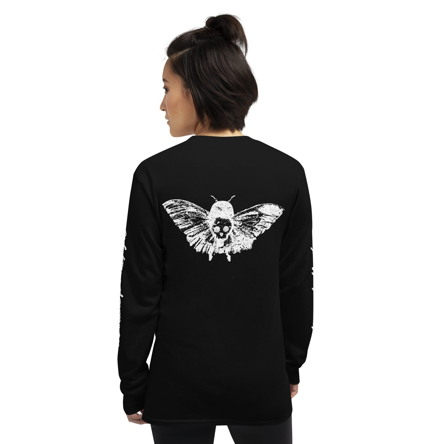 a woman wearing a black long sleeve tee with moth girl print in front and back and text on sleeves