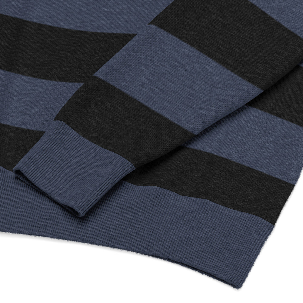 a grunge style dark striped sweater with the text "here we are now"