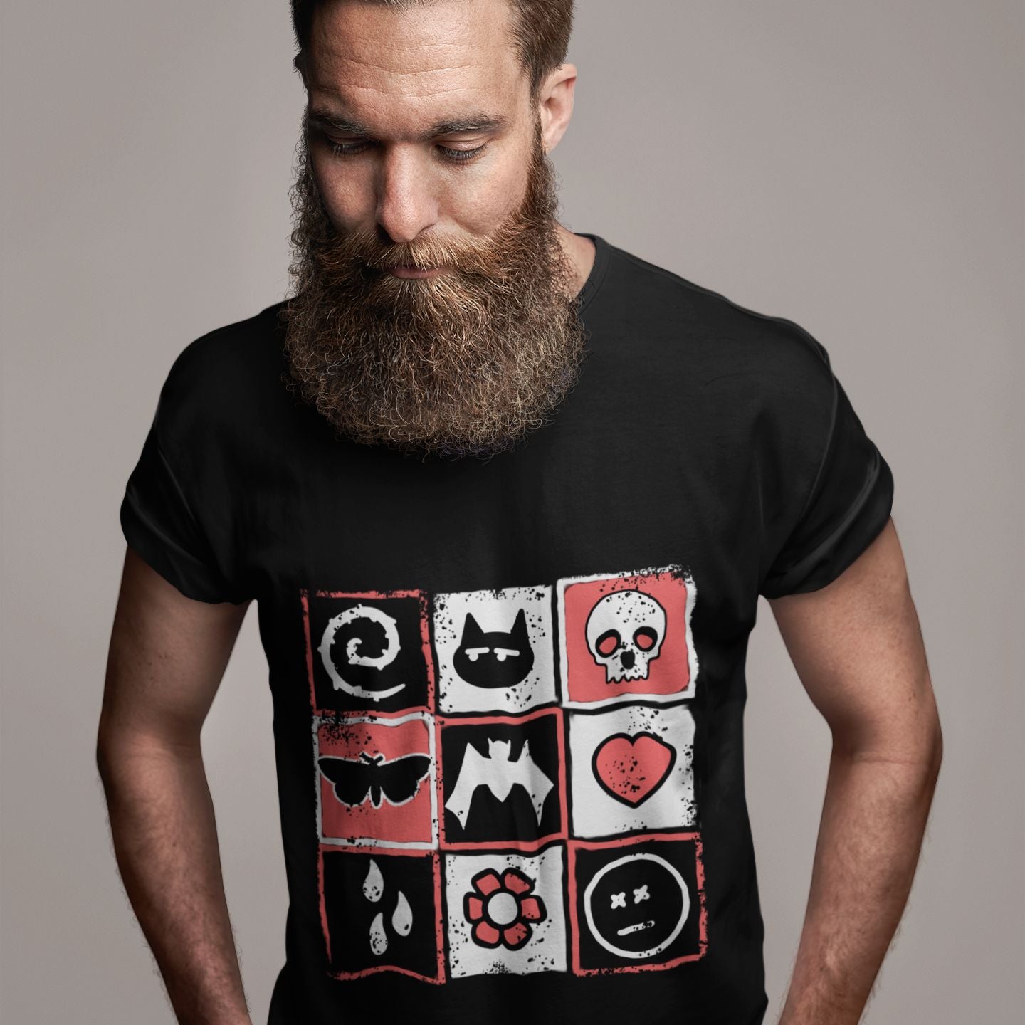 a bearded man wearing a black t-shirt with a pink and black distressed graphic with emo symbols and the word "emo" spelled diagonally