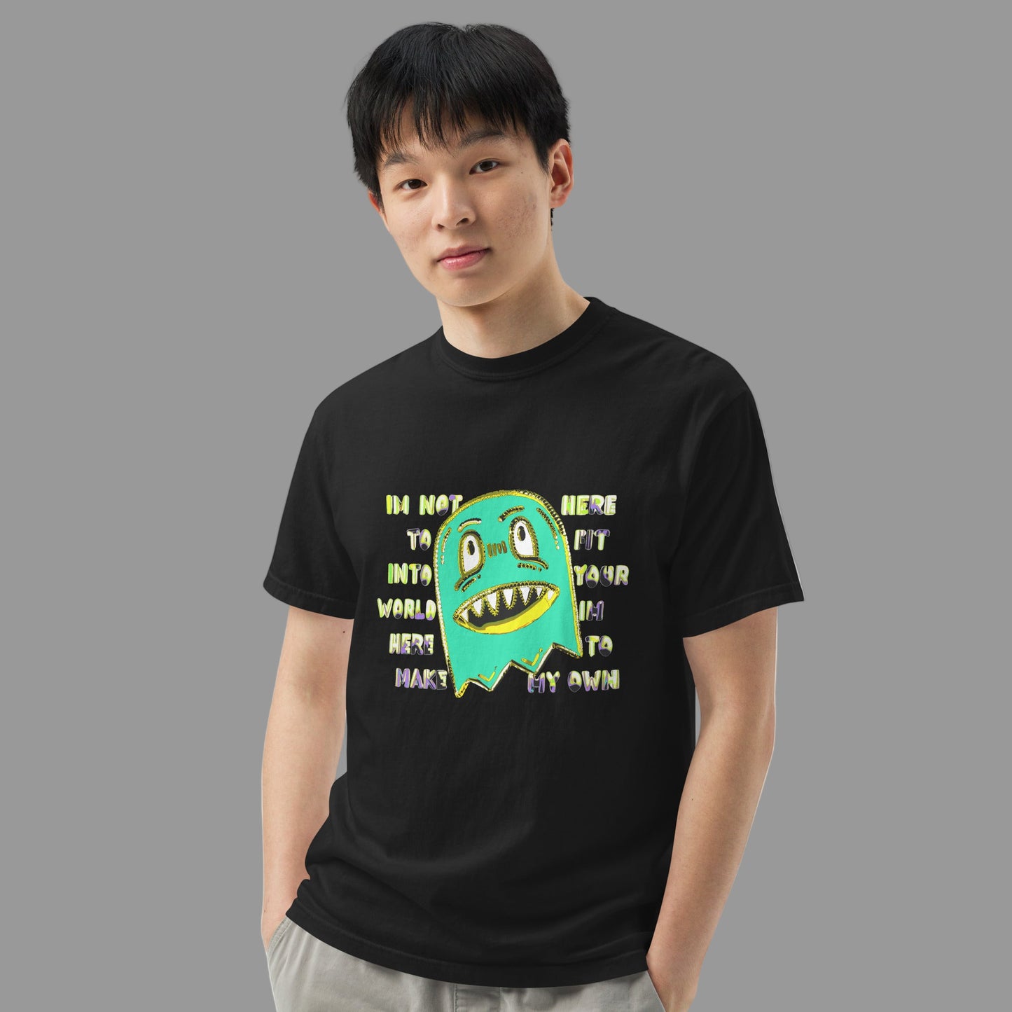 man wearing a t-shirt with a monster and text "im not her to fit into your world"