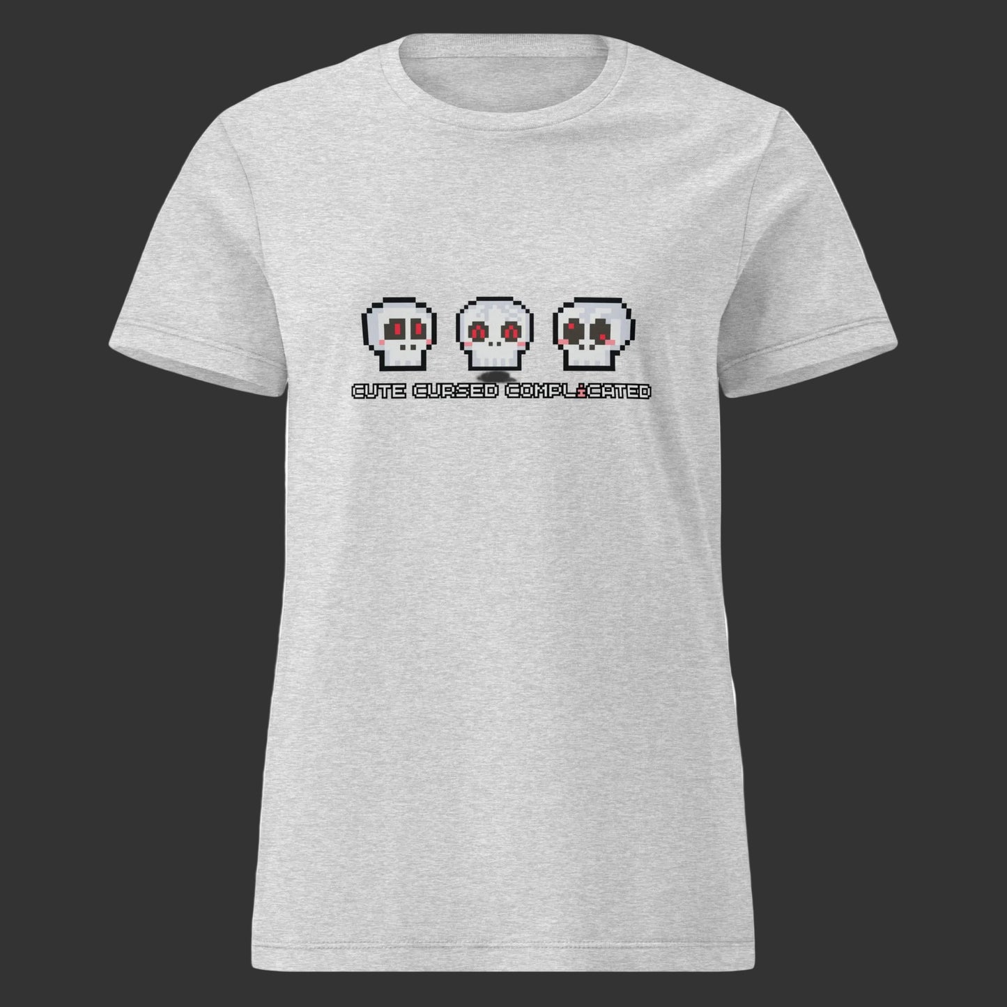 A women's fit t-shirt with pixel art skulls and text "cute cursed complicated"