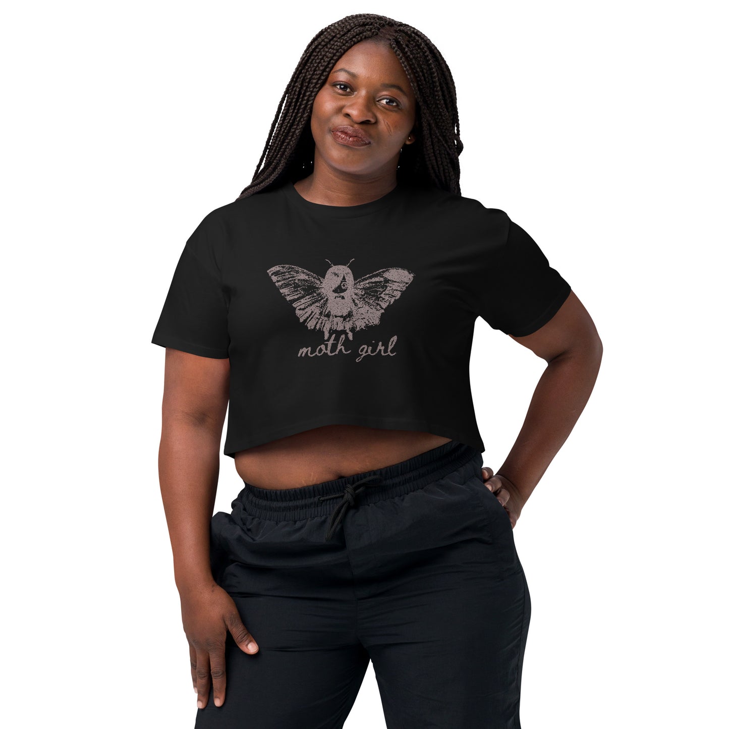 Woman wearing a black cropped t-shirt with a moth girl design and 'moth girl' text