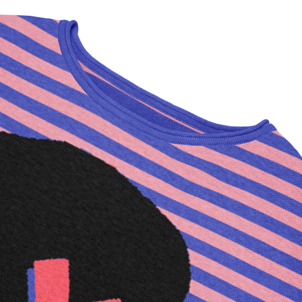 detail of a sweater with pink and blue stripes and an x-eyed black skull design