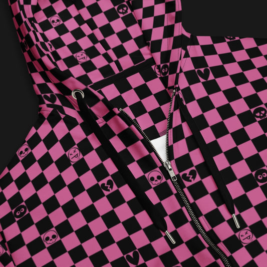 a black and pink zip hoodie with a checkered pattern with small emo symbols