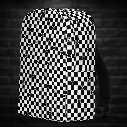 A backpack with black and white checkers, and with emo symbols in some of the white squares 
