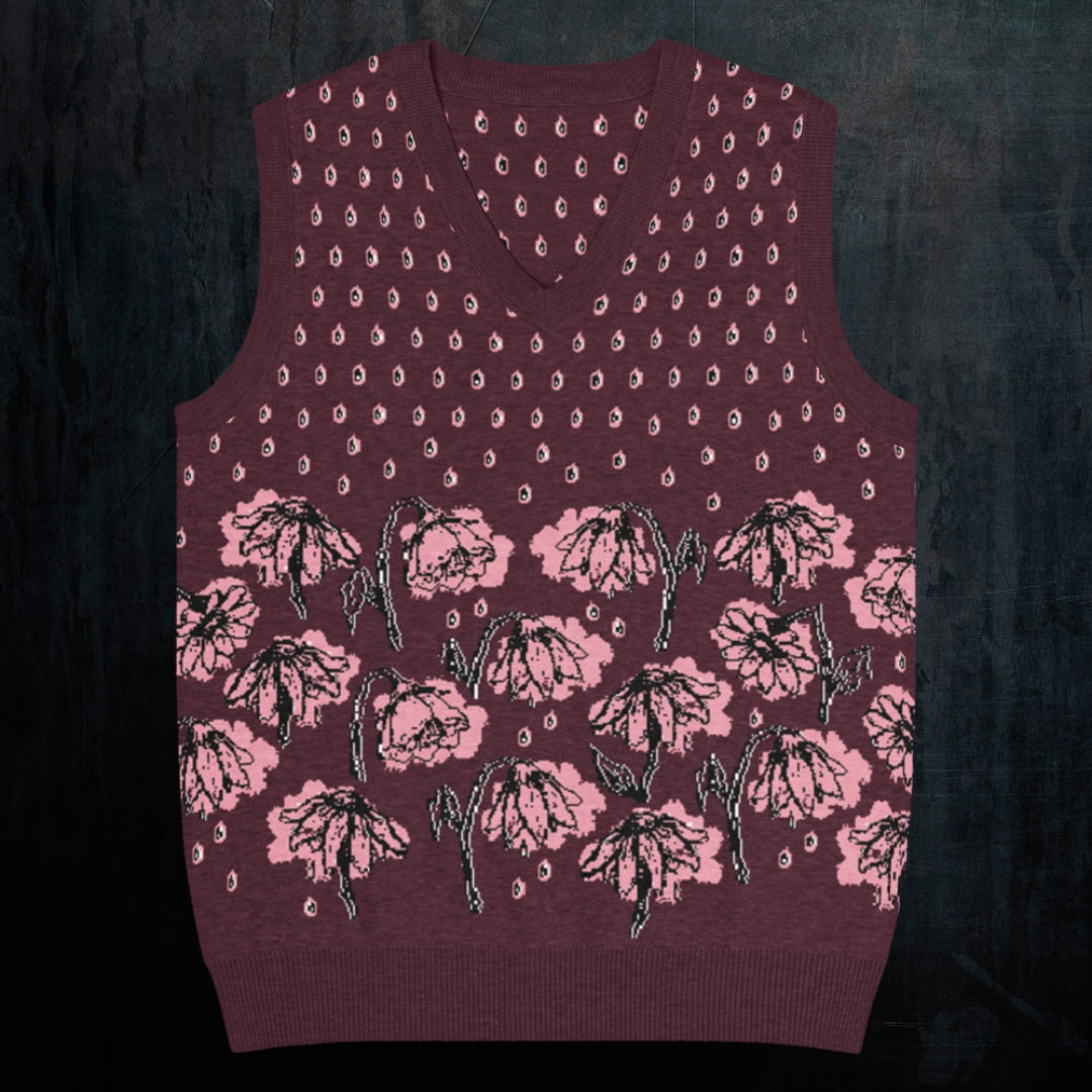 a burgundy knitted vest with crying pink flowers and droplets