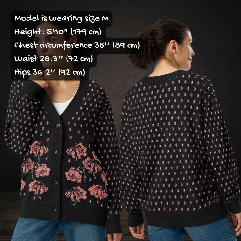 Person wearing an emotional black knitted cardigan with tears and crying flowers with sizing info