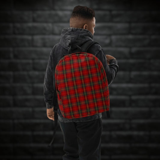 Person carrying a backpack with classic red punk tartan print