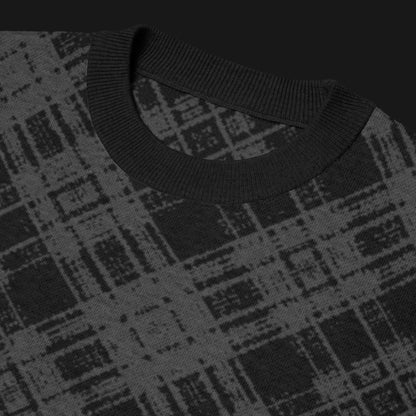 A dark black and charcoal broken plaid pattern knitted tee