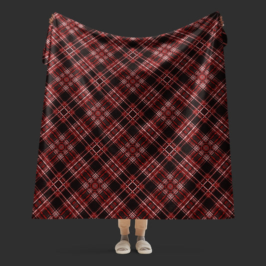a fleece sherpa blanket with a red alt emo colored plaid pattern