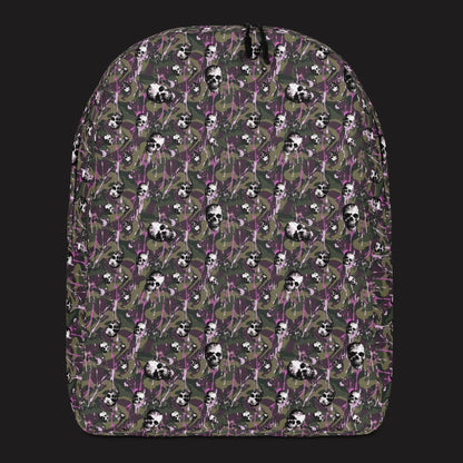 a backpack with a camo and paint and gritty skulls pattern in camo and purple