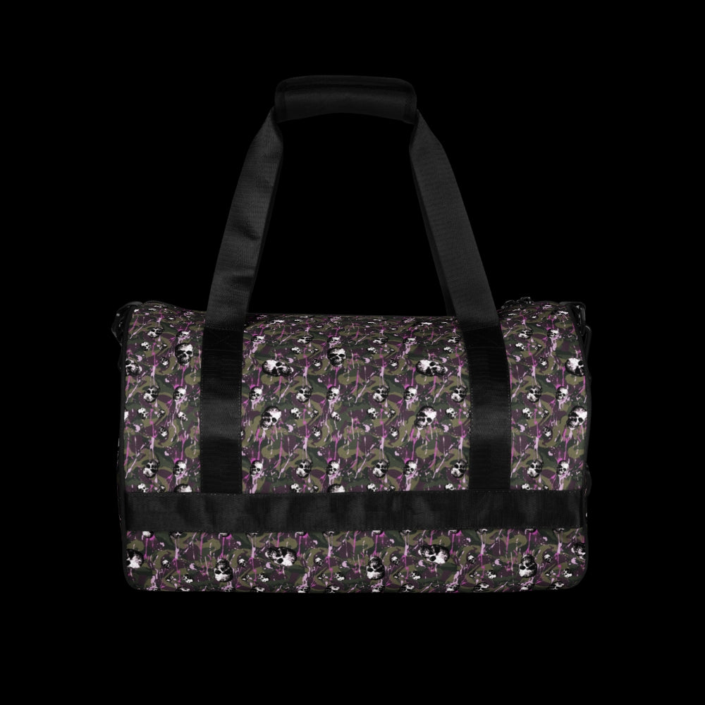 a duffel gym bag with a camo, paint splatter, and gritty skulls pattern in camo and purple shades