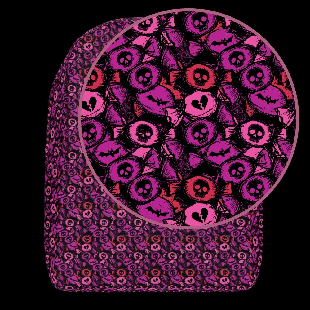 a backpack with an alt emo skull candy pattern in purple pink and red