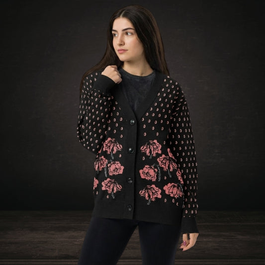 Person wearing an emotional black knitted cardigan with tears and crying flowers