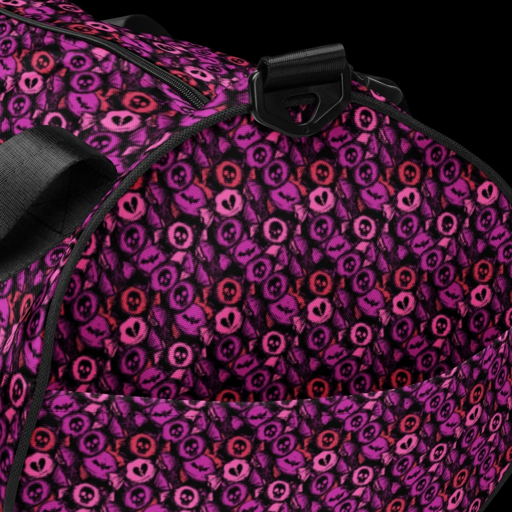 Duffel bag with a skull candy pattern in pink shades