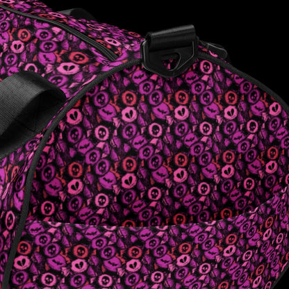 Duffel bag with a skull candy pattern in pink shades