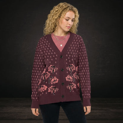 Person wearing an emotional burgundy knitted cardigan with tears and crying flowers