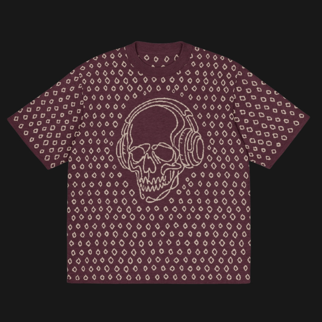 A burgundy short sleeve knit featuring a line art skull with headphones and hand drawn diamonds