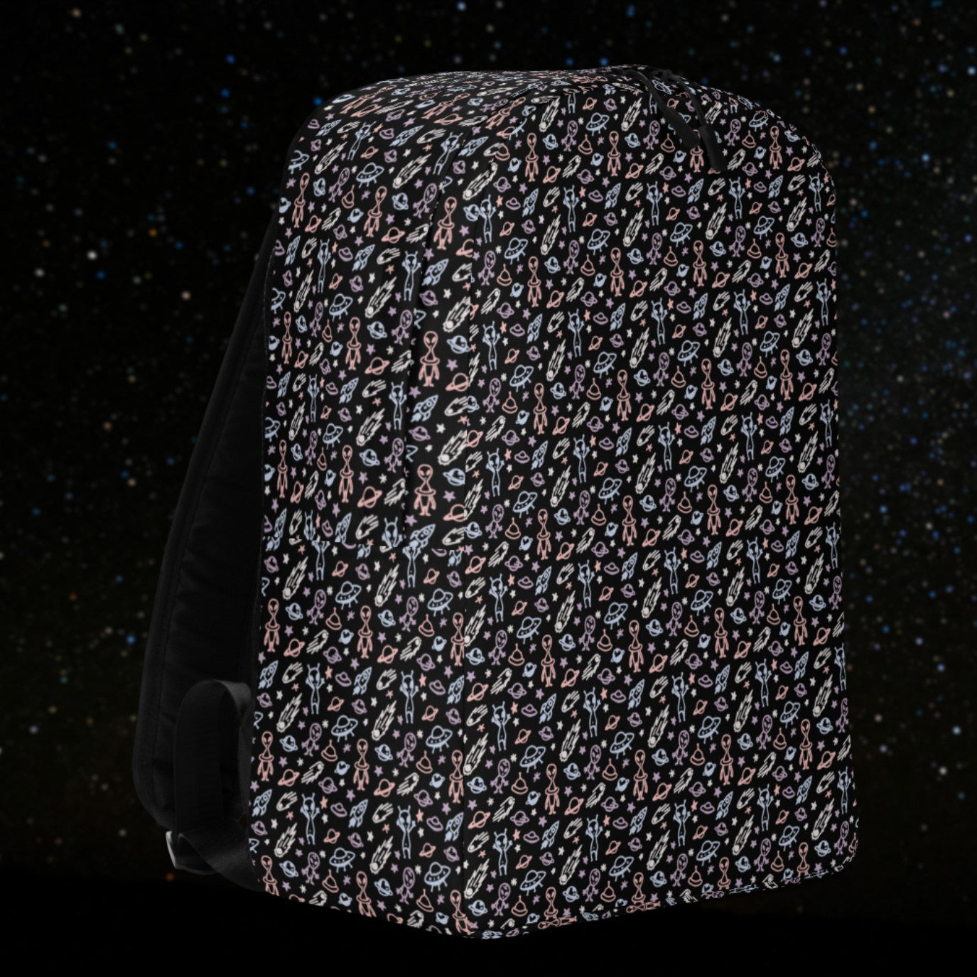 backpack with a hand drawn space pattern featuring scattered confused aliens, planets, comets, and UFOs in pastel on black. 