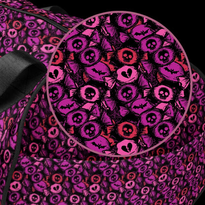 Duffel bag with a skull candy pattern in pink shades