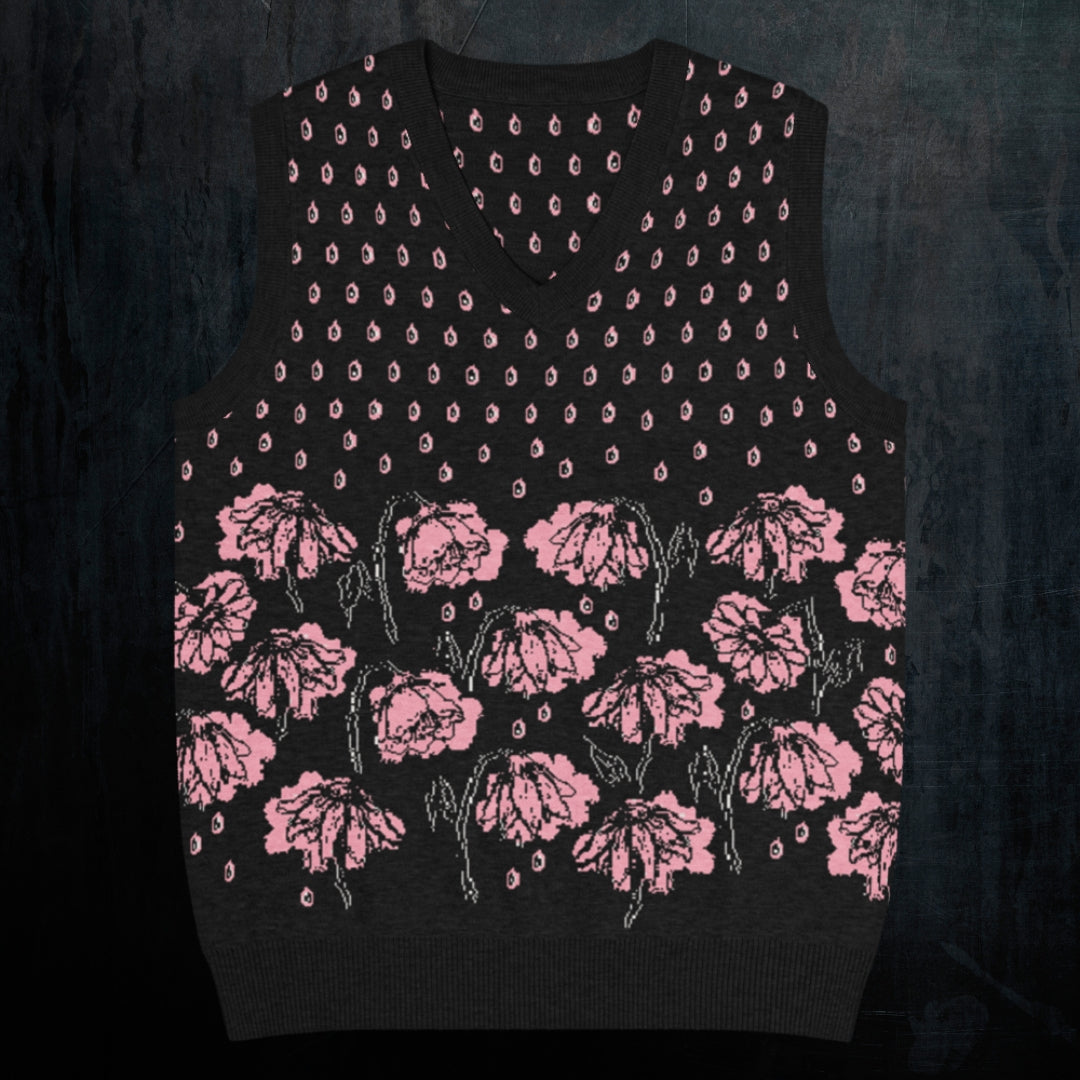 a black knitted vest with crying pink flowers and droplets