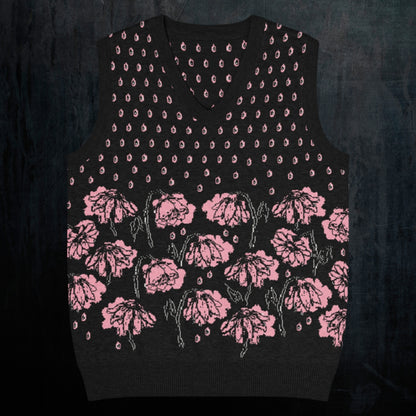 a black knitted vest with crying pink flowers and droplets