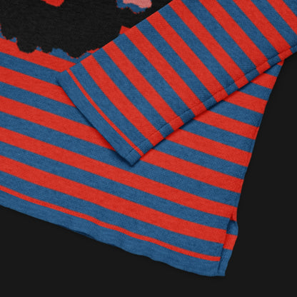 Red and blue striped sweater with a large x-eyed skull design